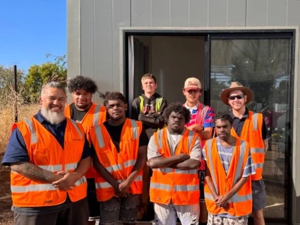 RedDoor cabin-building social enterprise crew in hi-vis